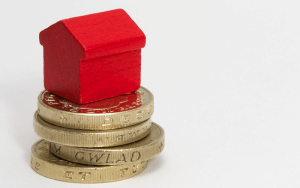 monopoly house with pound coins