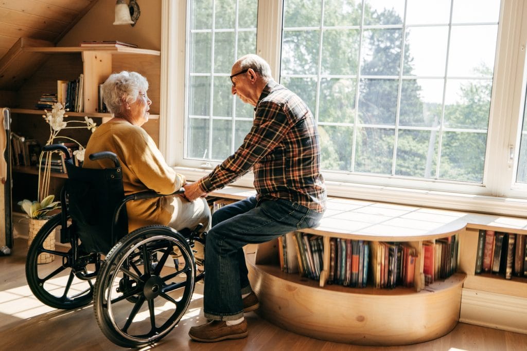 elderly couple considering how equity release affects care costs
